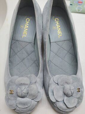 Chanel light blue suede Camellia featuring a floral accent